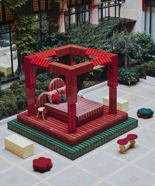 green and red ceramic tiles clad sculptural daybed by uchronia at hôtel plaza athénée, paris